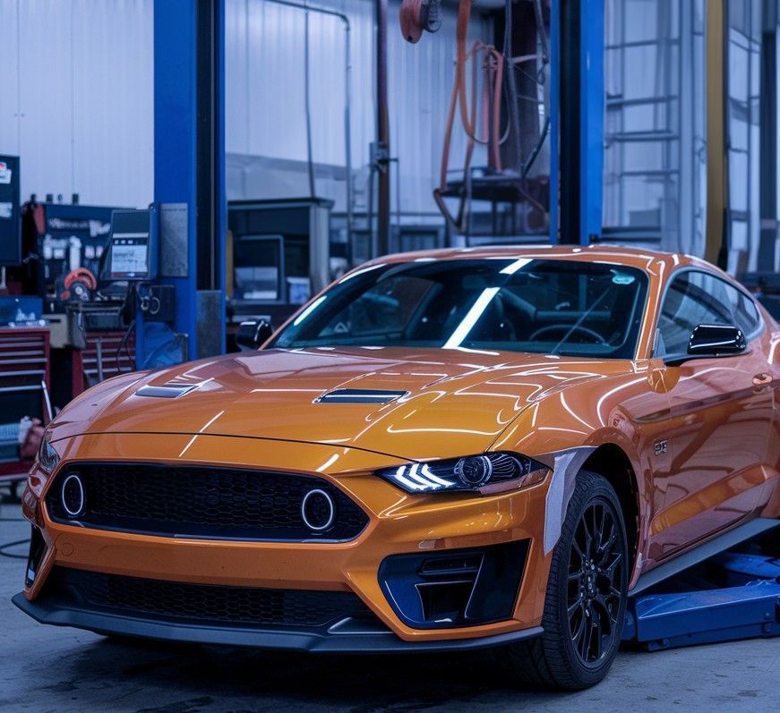 Orange Ford Mustang in Axelrod Body Shop