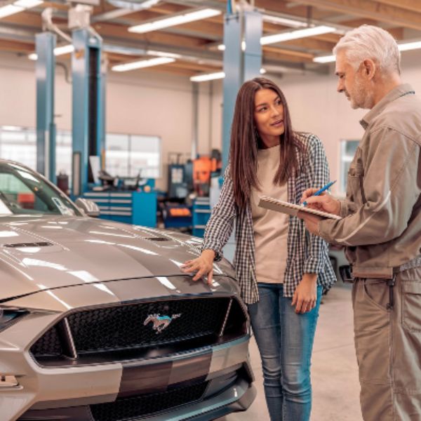 female-customer-with-ford-mustang-getting-a-quote-at-Axelrod-Cleveland-auto-body female-customer-with-ford-mustang-getting-a-quote-at-Axelrod-Cleveland-auto-body